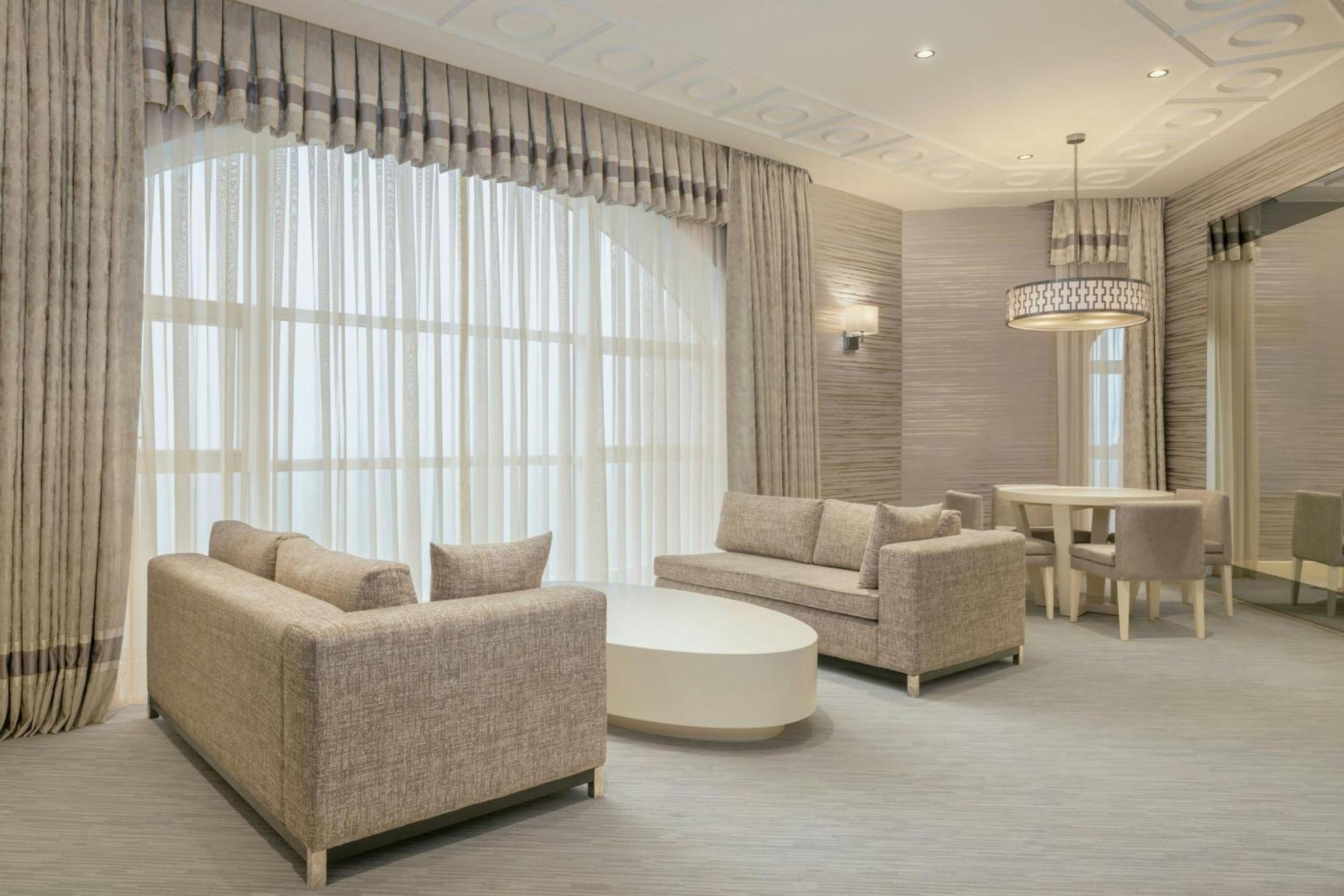 Sheraton Batumi Hotel Exteriör bild A living room with a large window