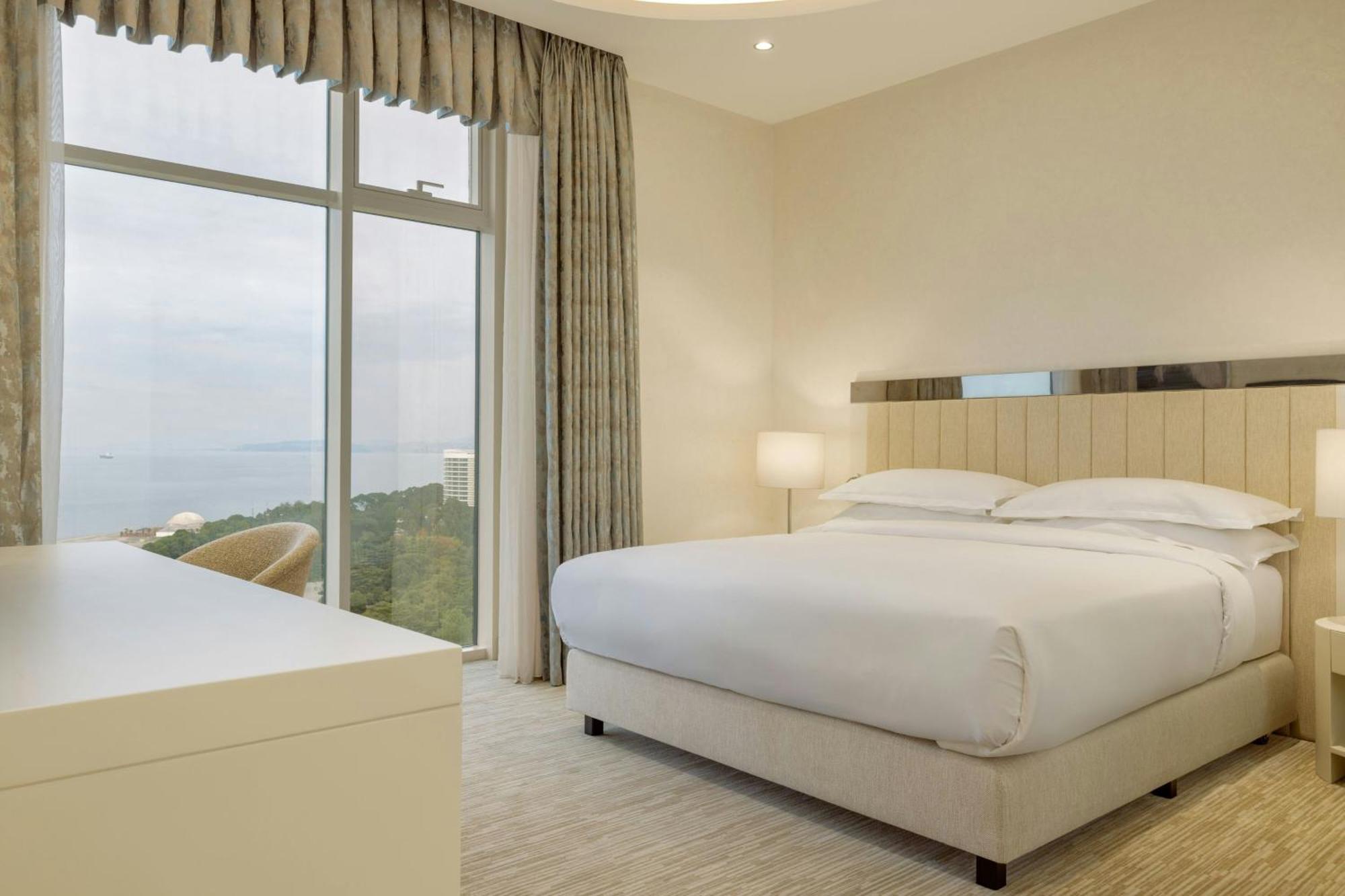 Sheraton Batumi Hotel Exteriör bild A bedroom at the hotel
